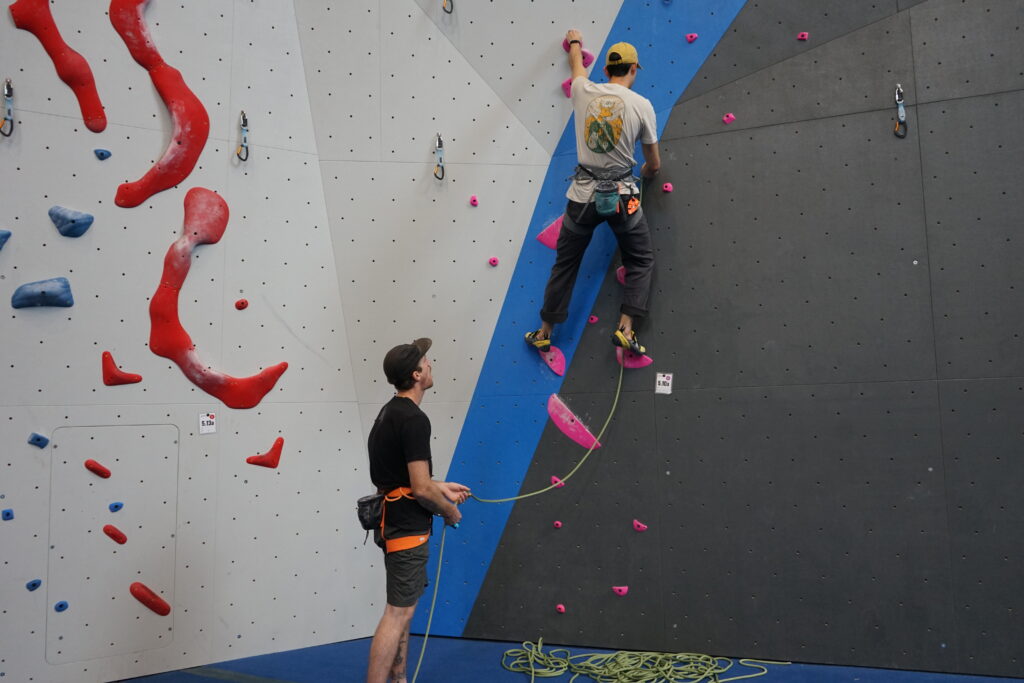 Two climbers on lead wall. Walls are a part of Matthews Phase 2. Climb on these during our Grand Re-Opening event.