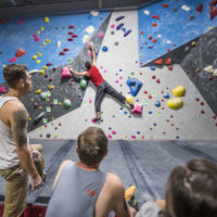 tall climber in red shirt at Inner Peaks Climbing & Fitness Charlotte NC